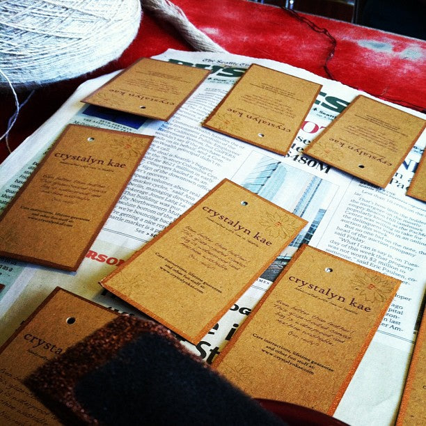 Why yes I am gold-leafing my hang tags for my bags the Chihuly museum