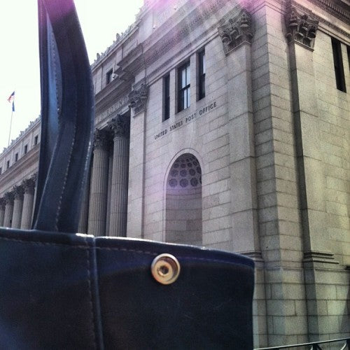 A mad dash to the post office: this bag was started in Seattle,...