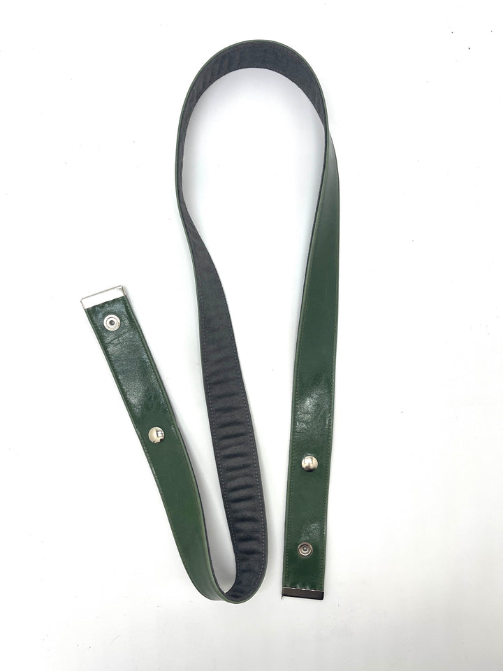 Green leather strap with silver buckles on a white background