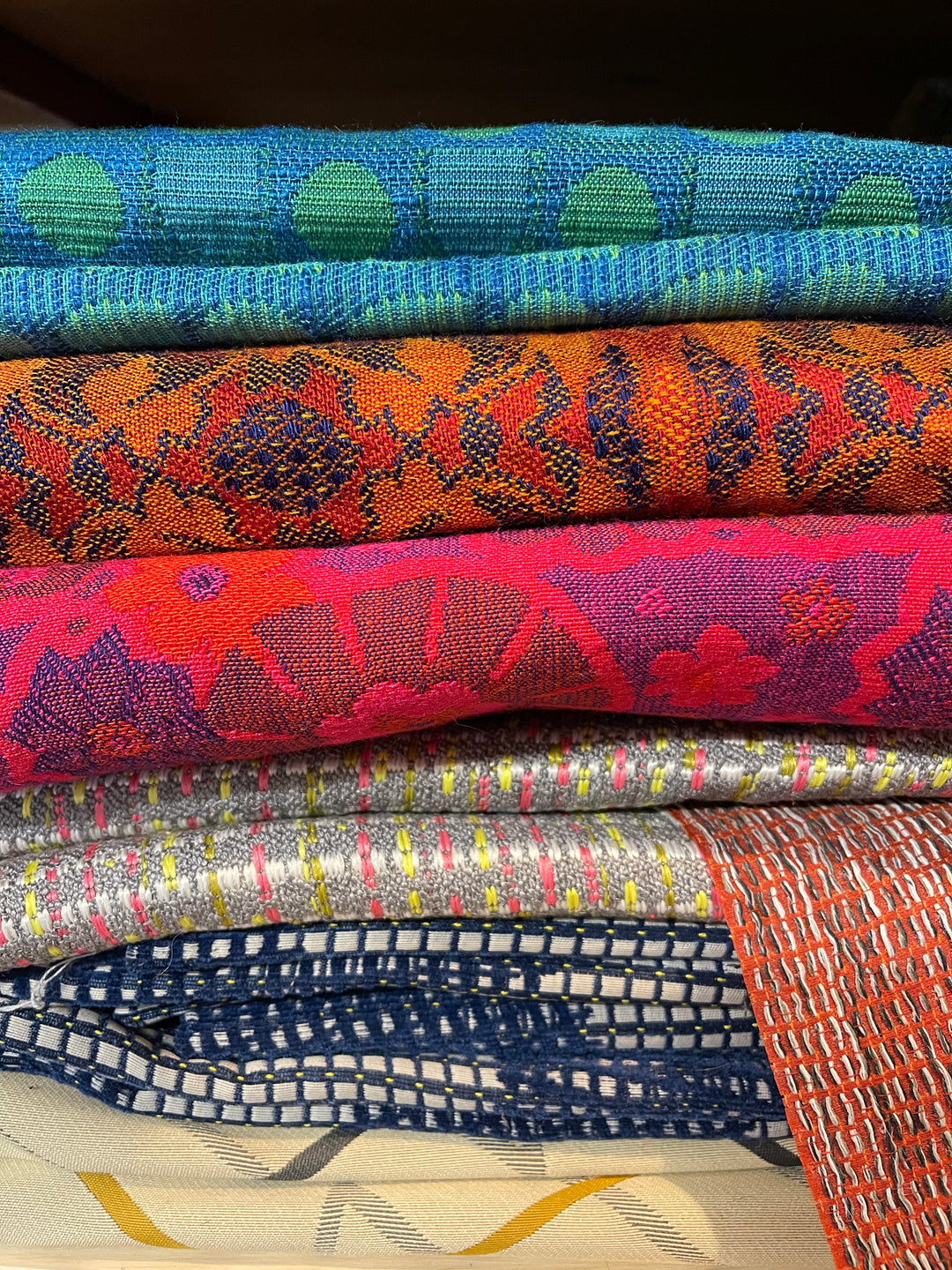 a colorful stack of fabrics from the boeing archive from 1970s airplanees
