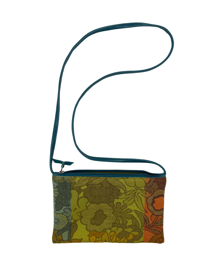 Floral patterned pouch with a green strap on a white background#color_yellow-bloom