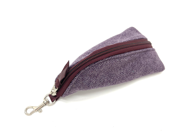 Purple fabric glasses case with a brown zipper on a white background #color_amethyst-tweed