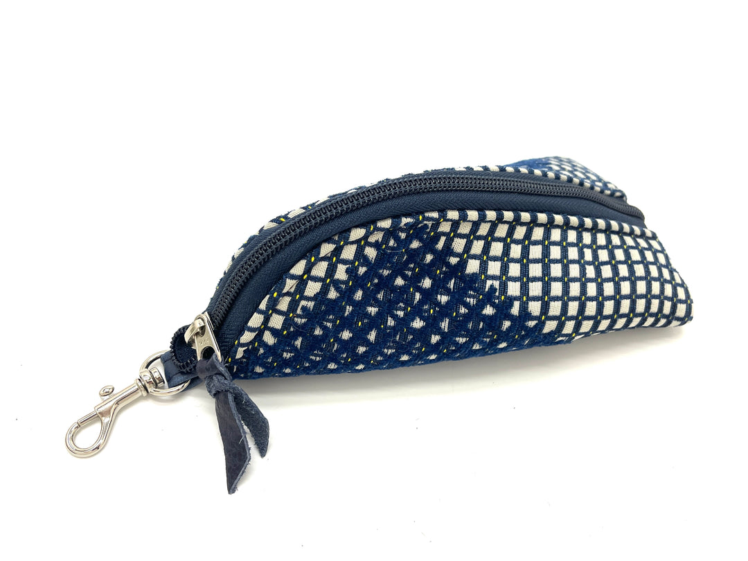 Small blue and white patterned pouch with a zipper on a white backgroundconstellation-cobalt