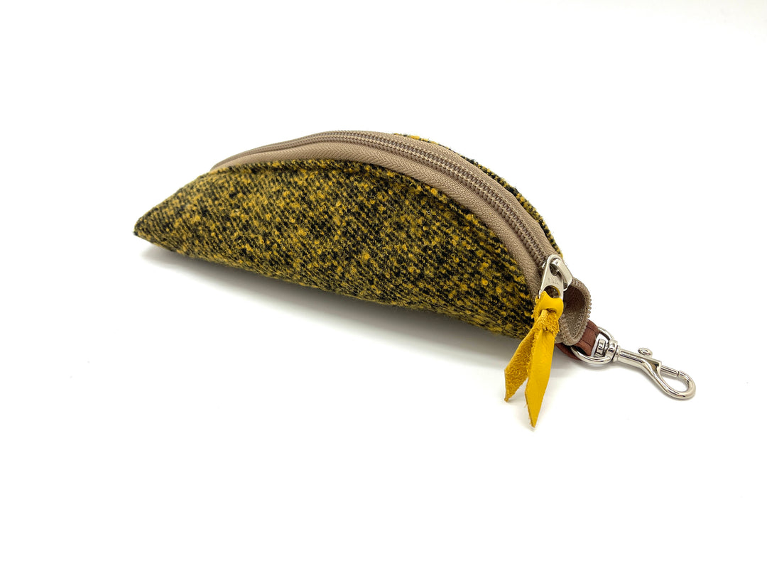 yellow Herringbone patterned coin purse with a yellow tag on a white #color_mustard-marle