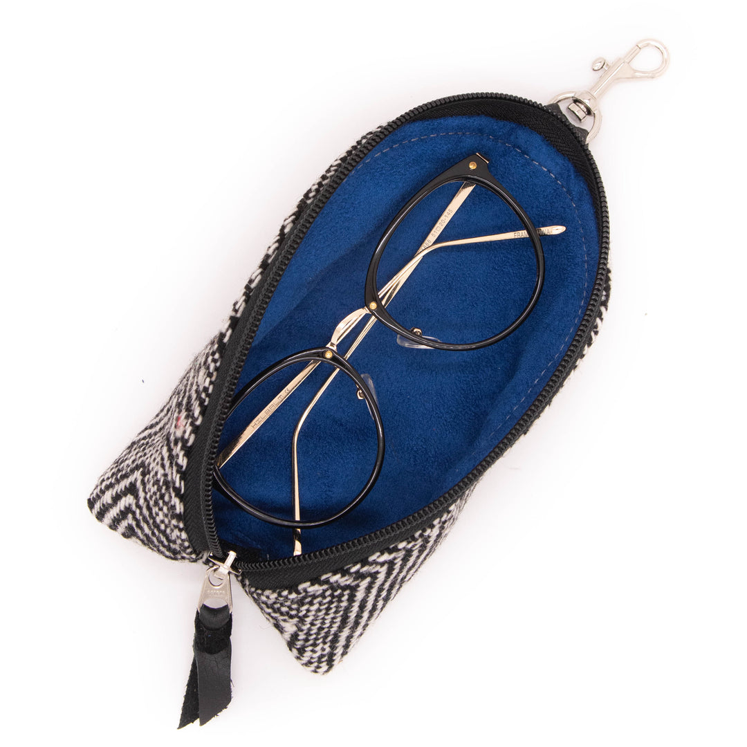Eyeglasses in a patterned case with a blue interior on a white background#color_crosswind-chevron