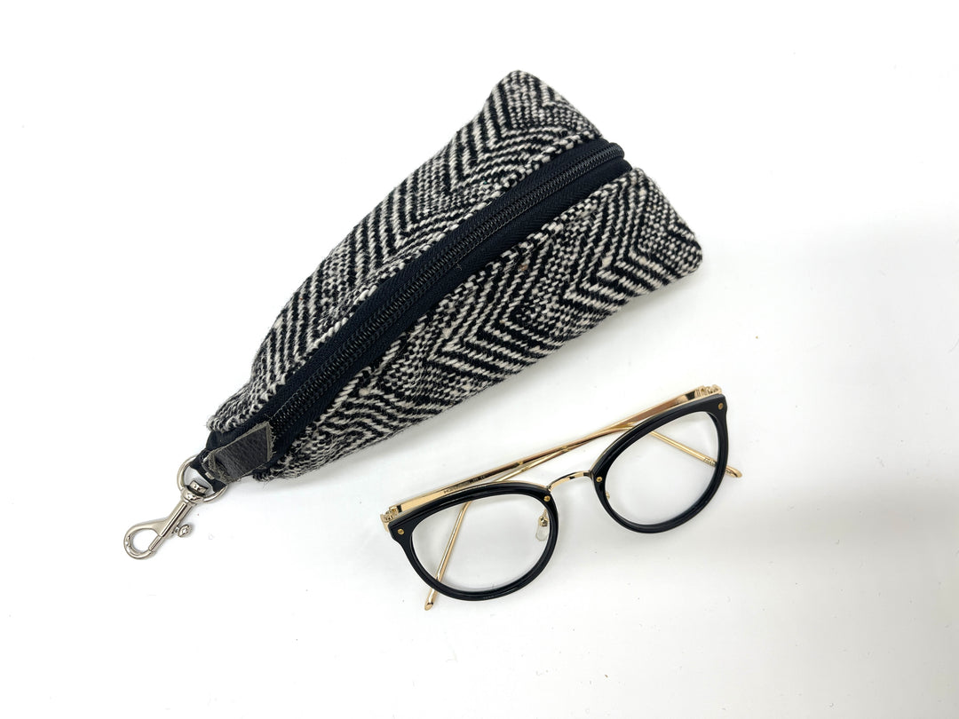 Fabric pouch with a zipper and glasses on a white background#color_crosswind-chevron
