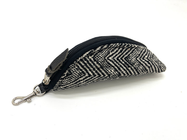 Herringbone patterned keychain pouch with black zipper on a white background#color_crosswind-chevron