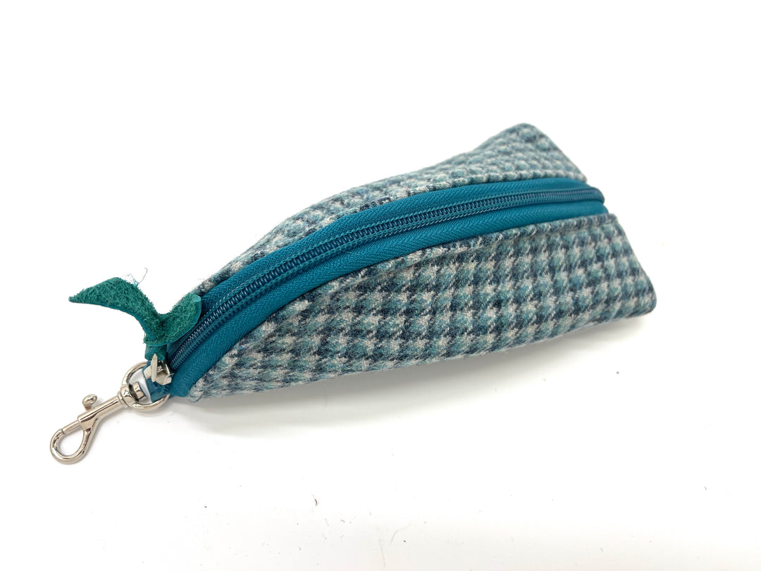 teal and gray checkered zippered pouch on a white background#color_highland-mist-check