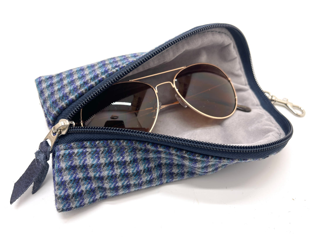 Blue checkered pouch with sunglasses on a white background#color_navy-highland-check