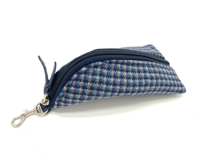 Blue and gray checkered pouch with a zipper on a white background#color_navy-highland-check
