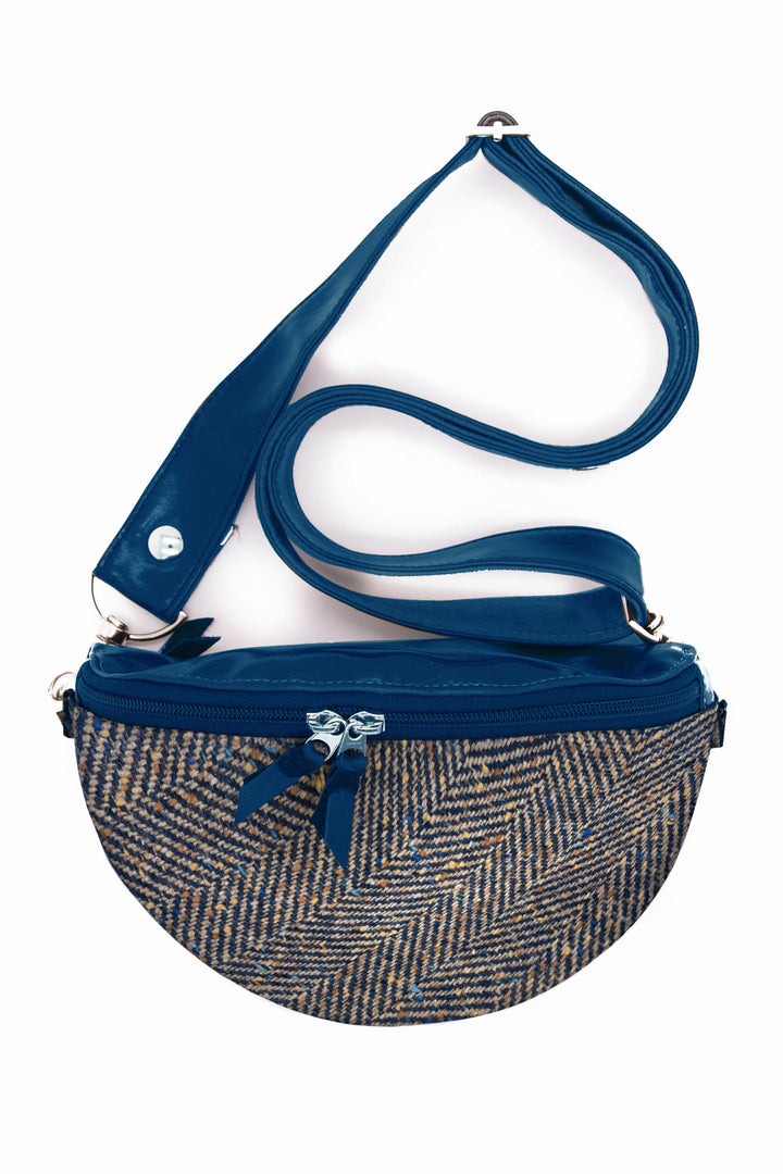 Blue and brown fanny pack crossbody bag on a white background#color_woodland-herringbone