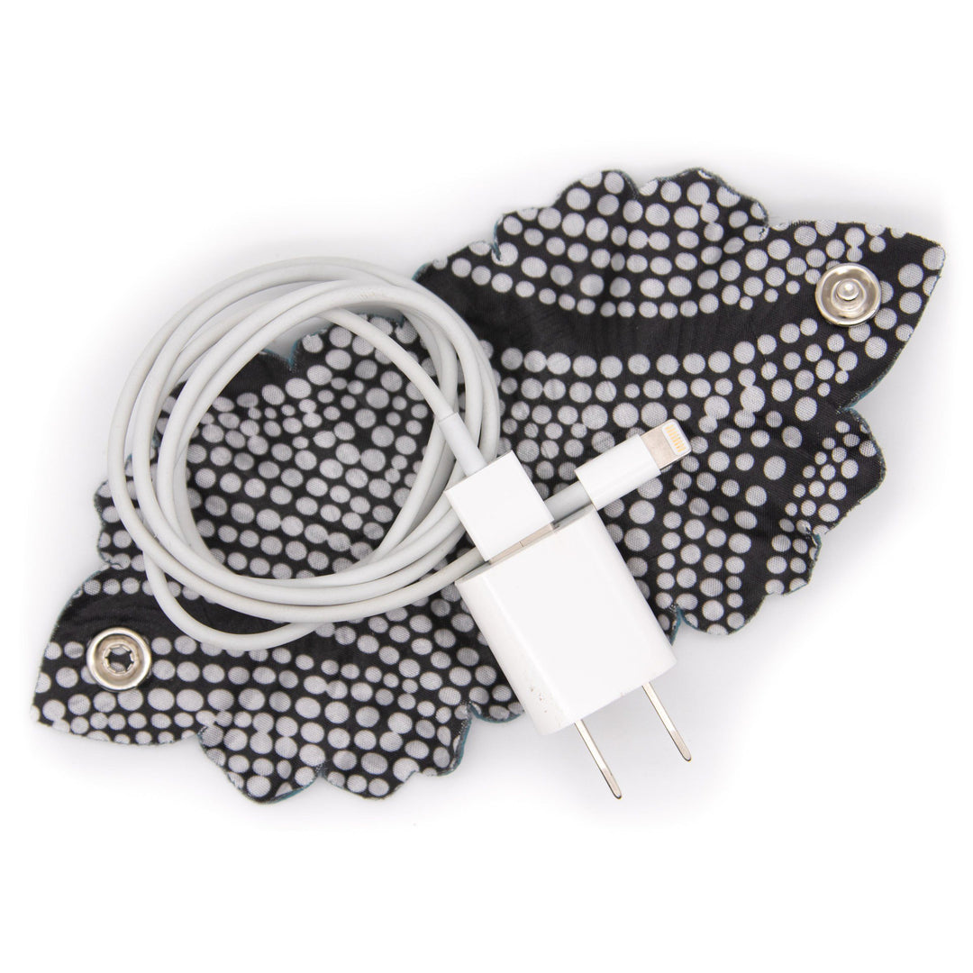 Laptop Leaf Cord Wrap with phone charger cord gathered inside